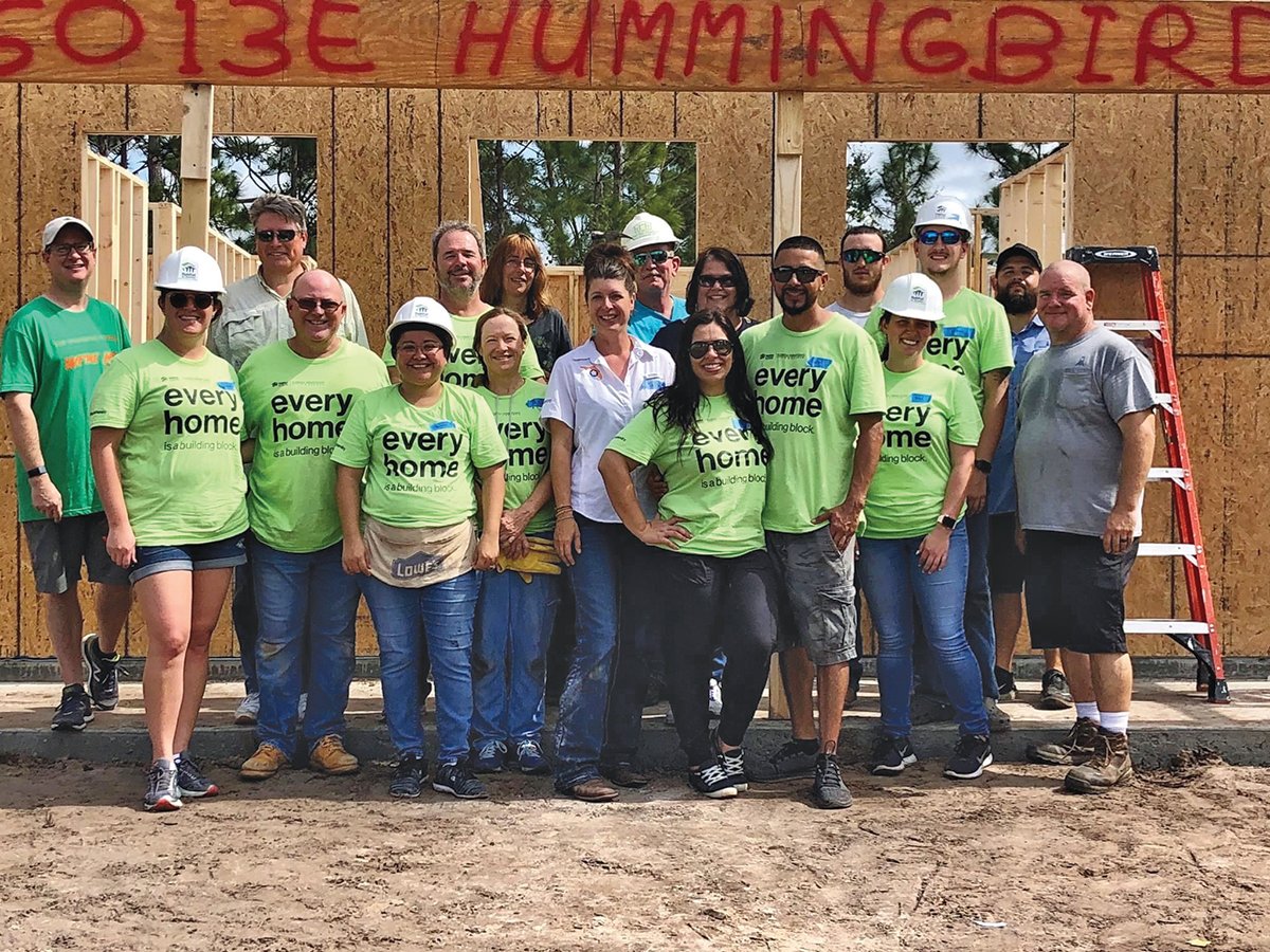 LABELLE — Volunteers from Habitat for Humanity of Lee and Hendry Counties gather for a photo in front of the home they are helping to build.